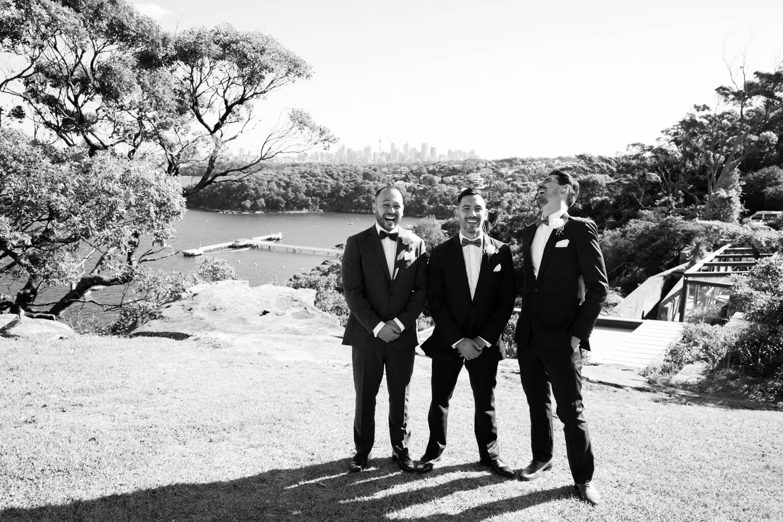 Groom and his best men waiting for the bride looking over Sydney